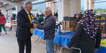 baskan-topaloglu-pazar-esnafini-ziyaret-etti.jpg